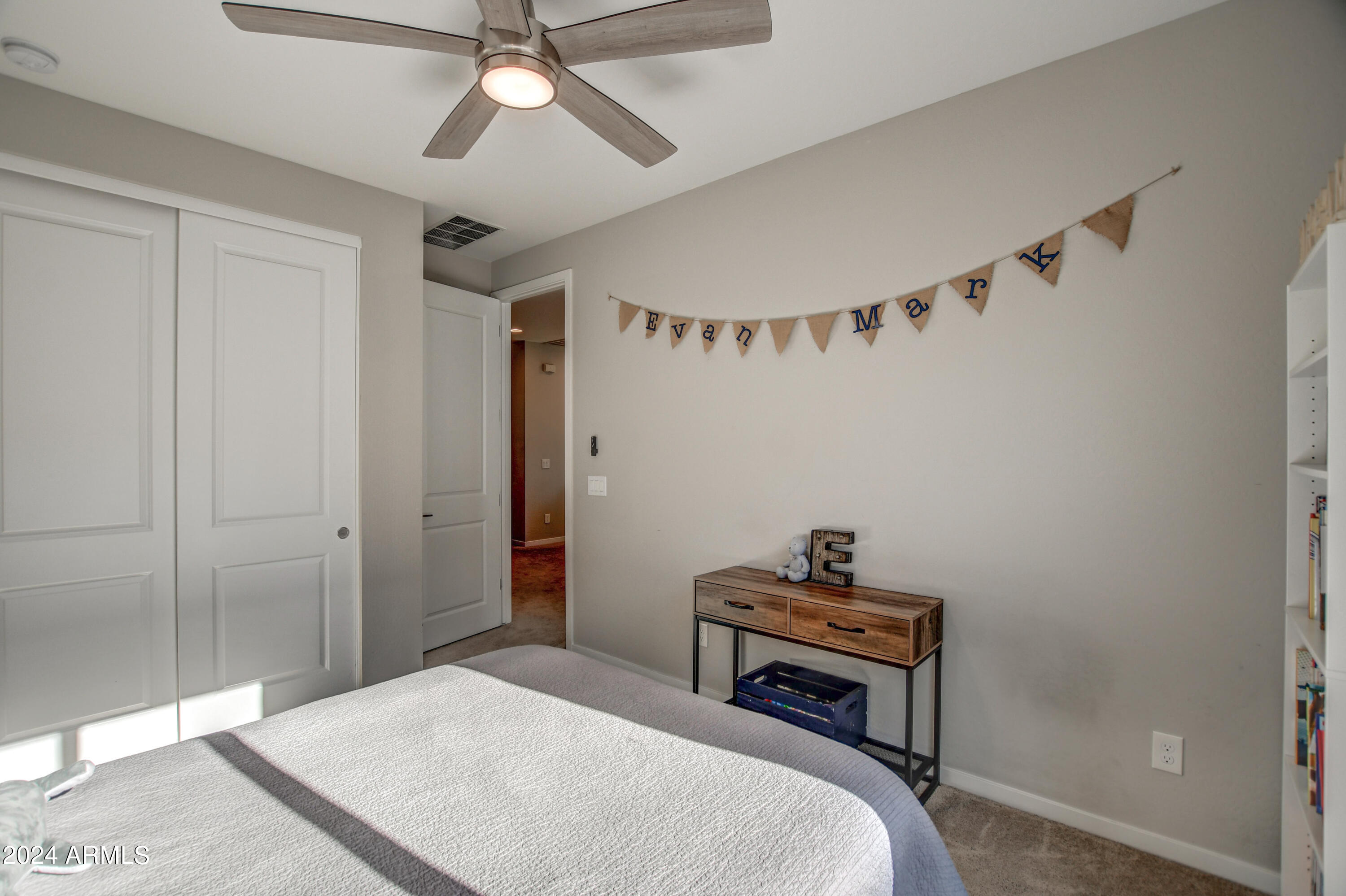901 South Smith Road, Unit 1033 Tempe, AZ 85281 - Photo 19 of 43 a bedroom with a bed and a chandelier