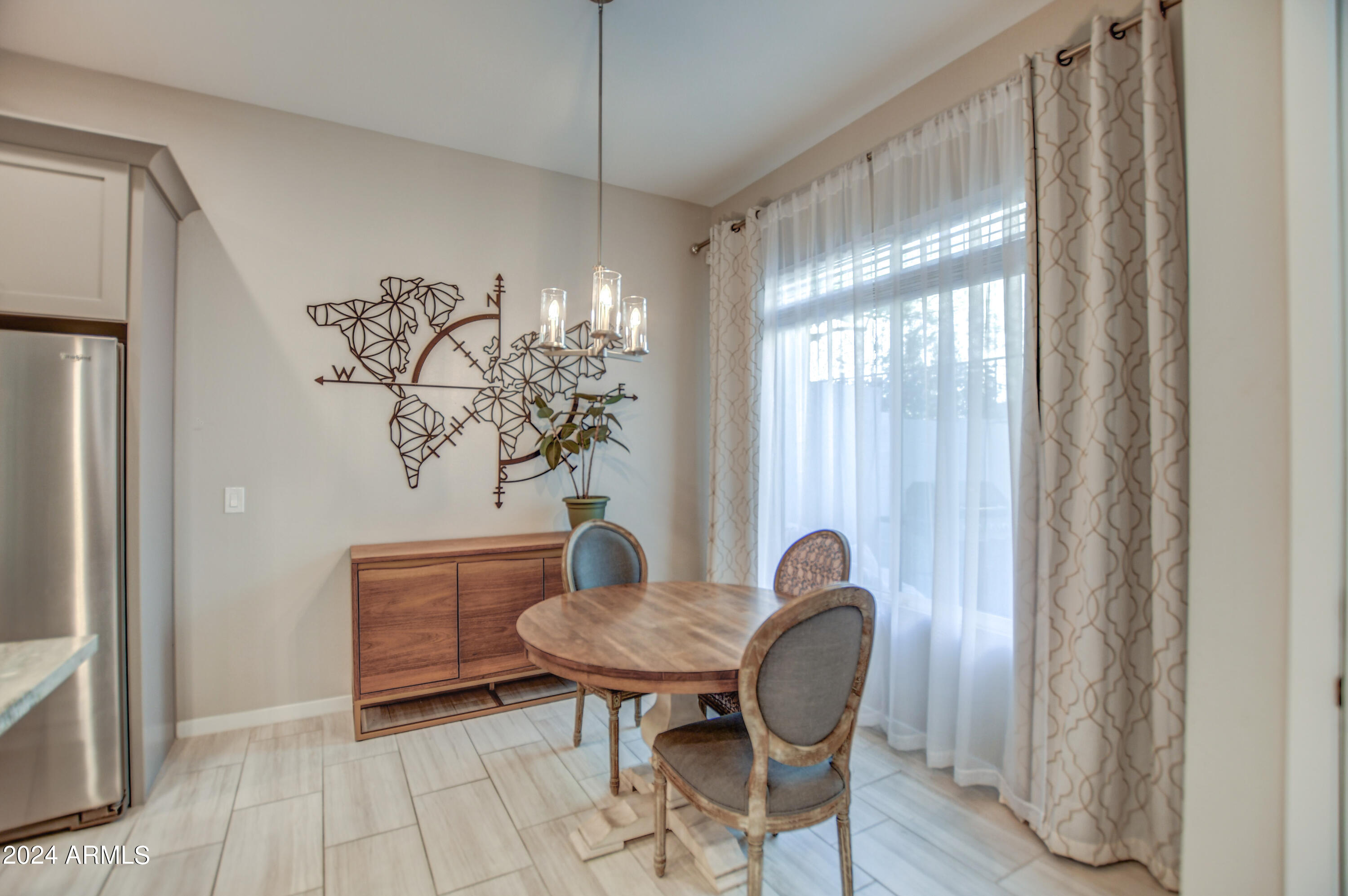 901 South Smith Road, Unit 1033 Tempe, AZ 85281 - Photo 20 of 43 a view of a dining room with furniture window and wooden floor