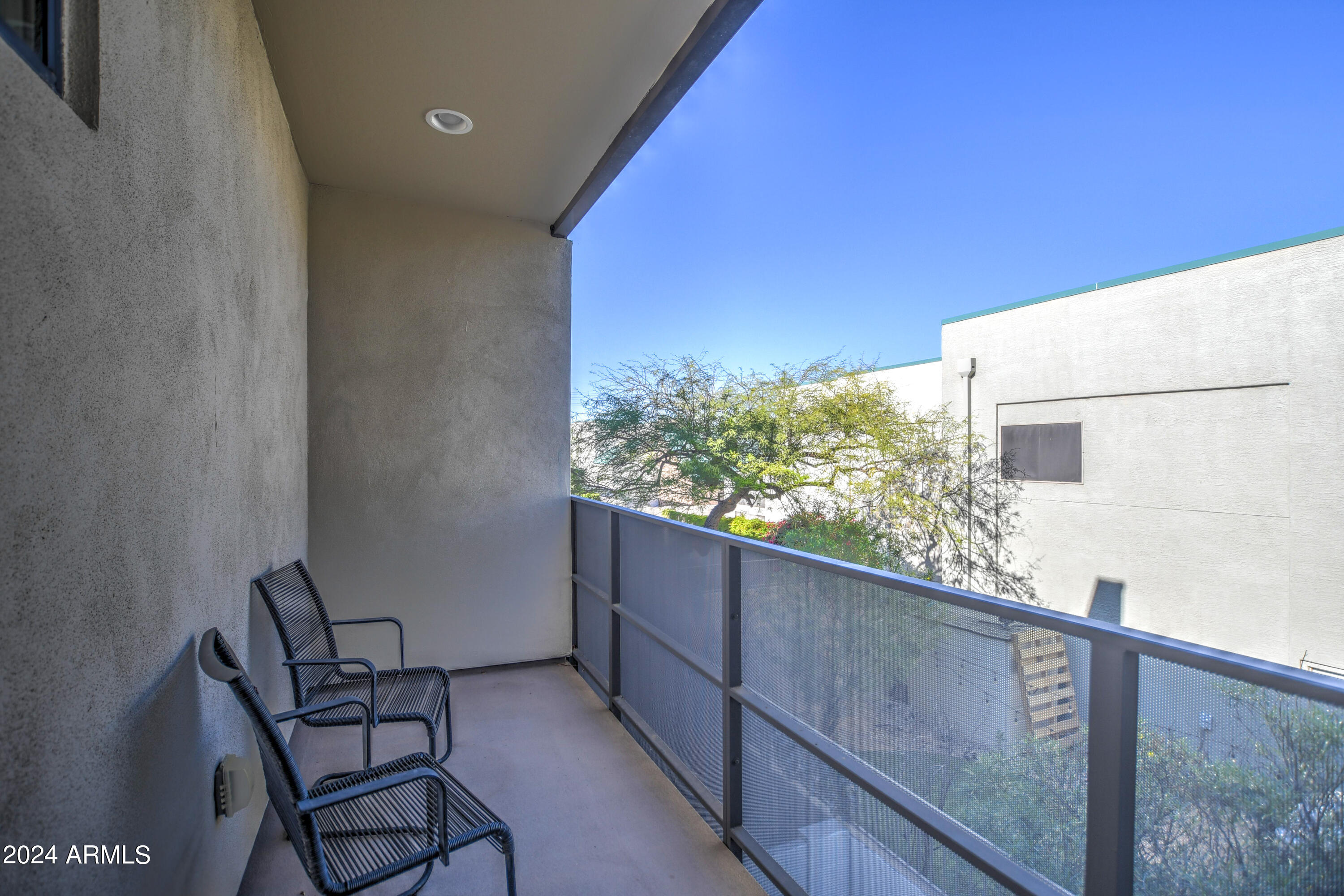 901 South Smith Road, Unit 1033 Tempe, AZ 85281 - Photo 27 of 43 a view of a balcony with chair