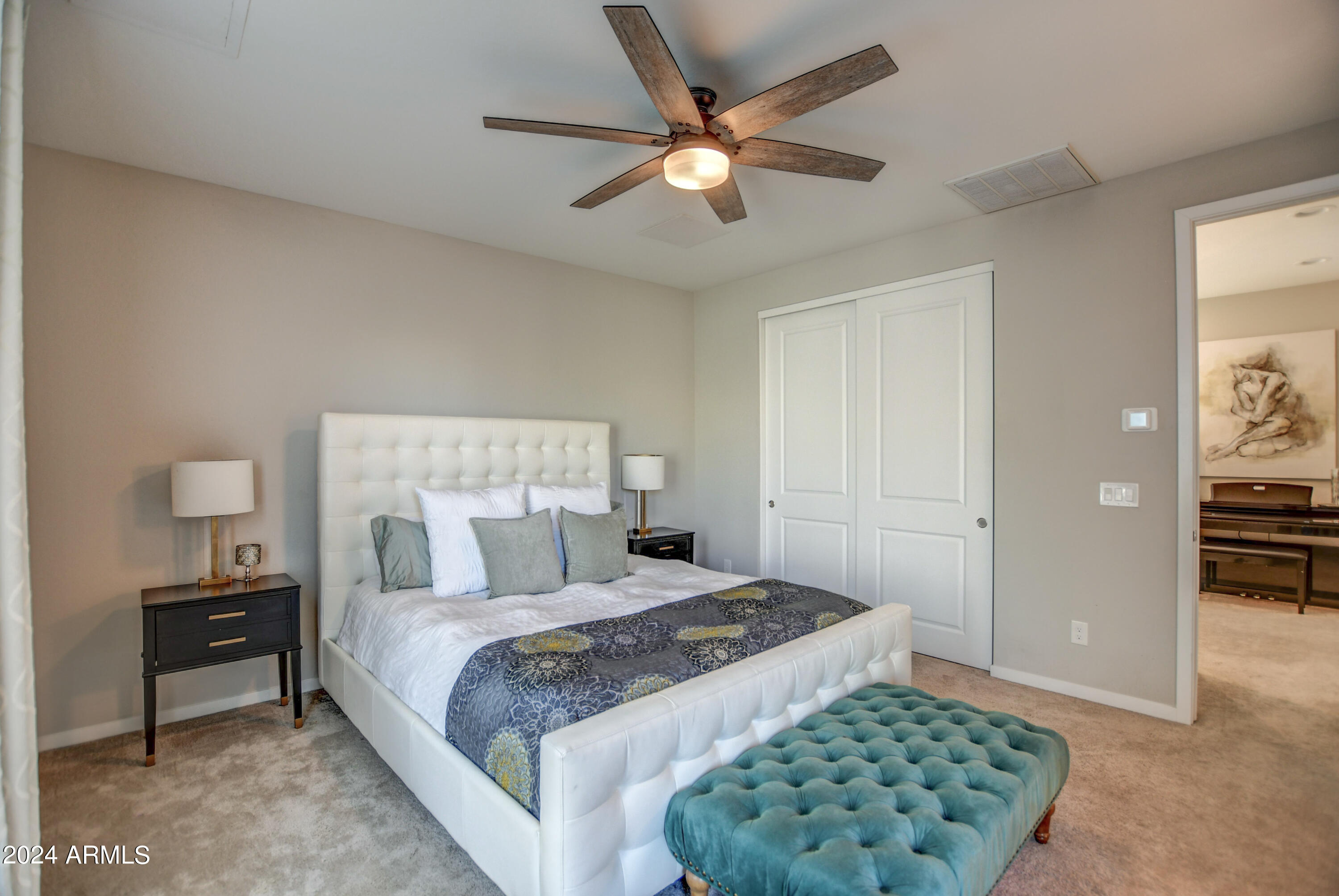 901 South Smith Road, Unit 1033 Tempe, AZ 85281 - Photo 34 of 43 a bedroom with a bed and a table in it