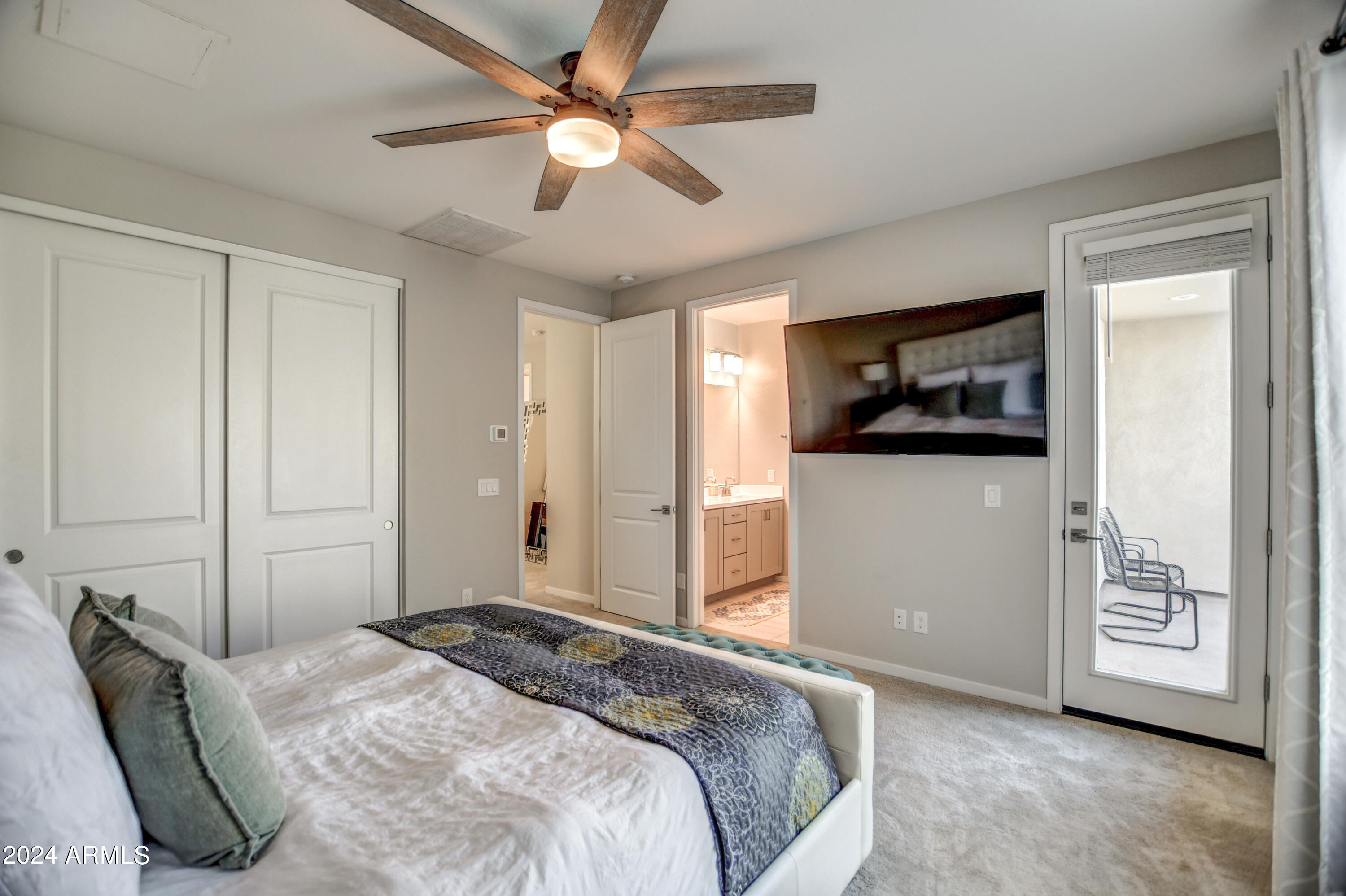901 South Smith Road, Unit 1033 Tempe, AZ 85281 - Photo 35 of 43 a bedroom with a bed and a television
