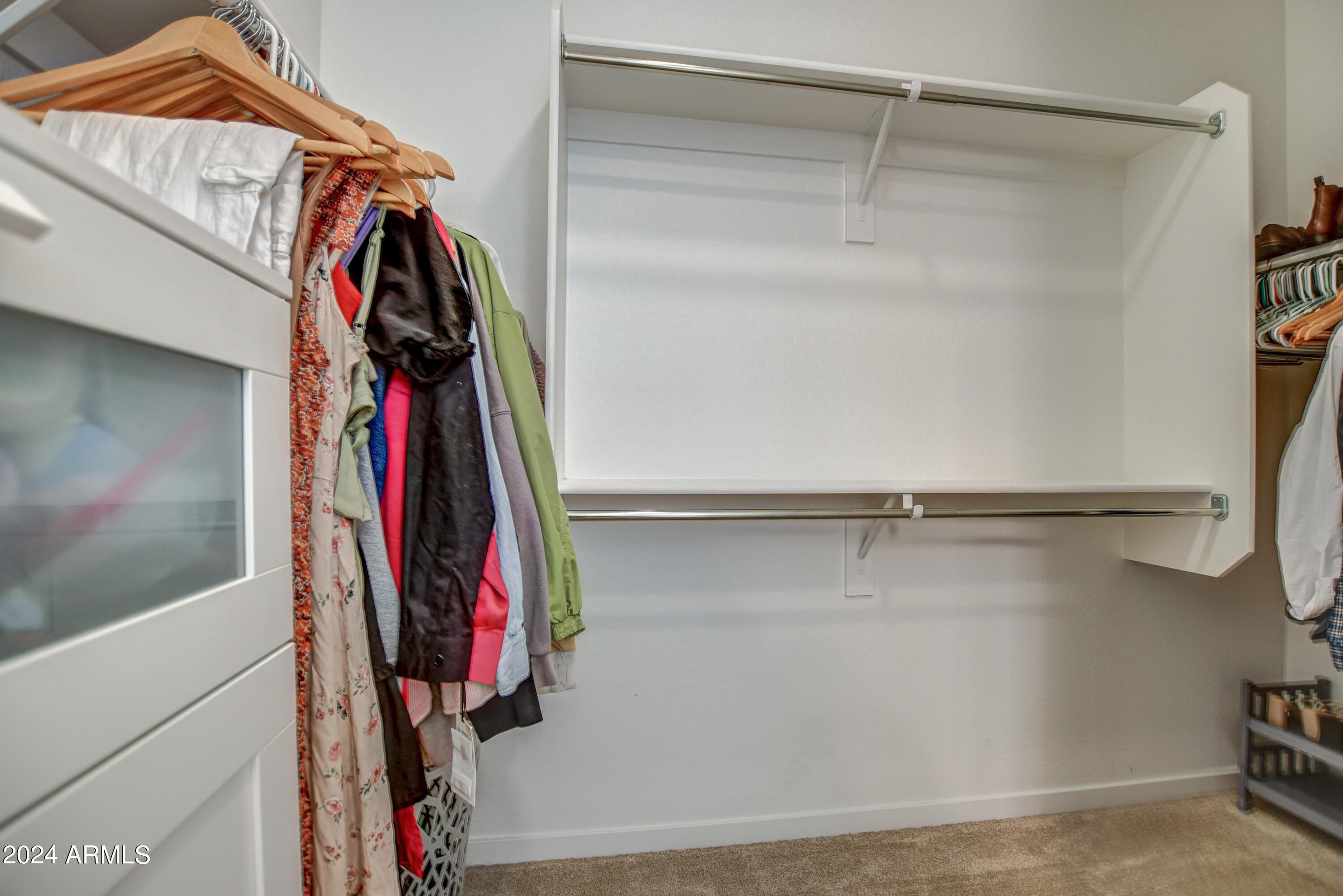 901 South Smith Road, Unit 1033 Tempe, AZ 85281 - Photo 36 of 43 a view of walk in closet with clothes and shoes