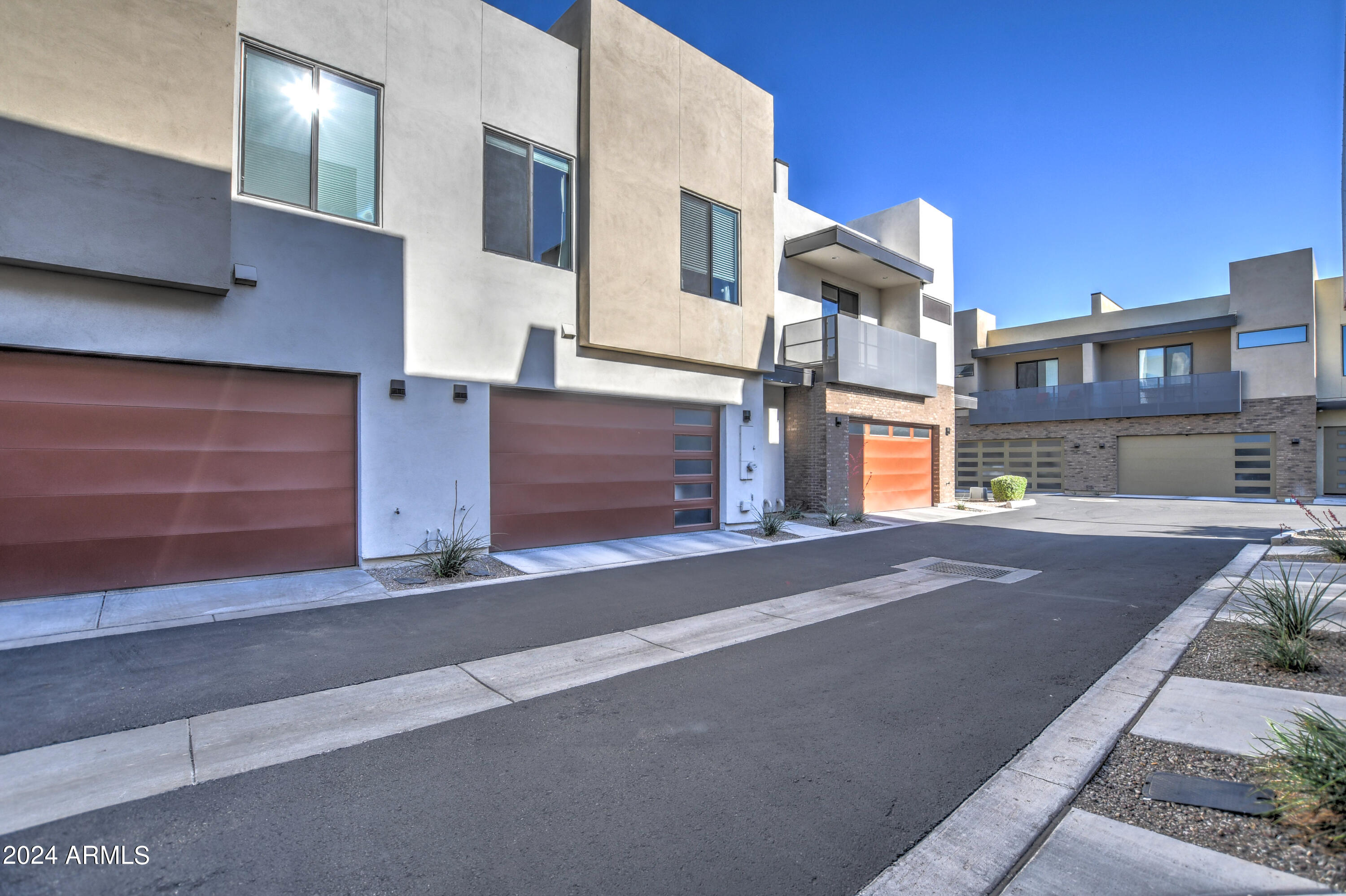 901 South Smith Road, Unit 1033 Tempe, AZ 85281 - Photo 42 of 43 a front view of a house with a yard and garage