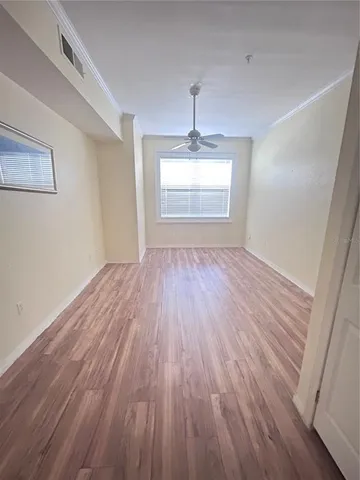 a view of room with window wooden floor and window