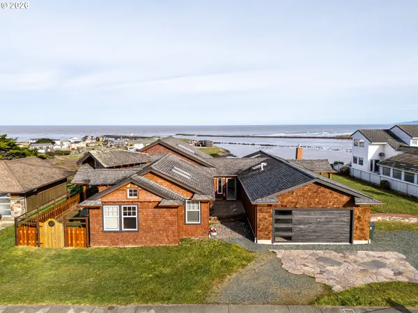 an aerial view of a house with a yard