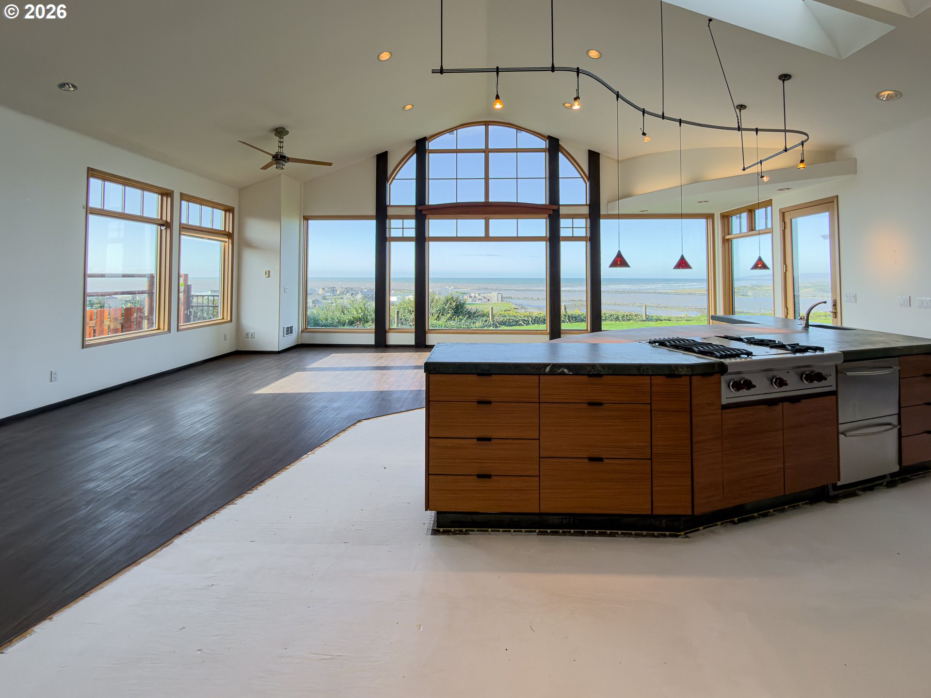 880 Ocean Drive Southwest Bandon, OR 97411 - Photo 13 of 48 a kitchen with a sink and a large window