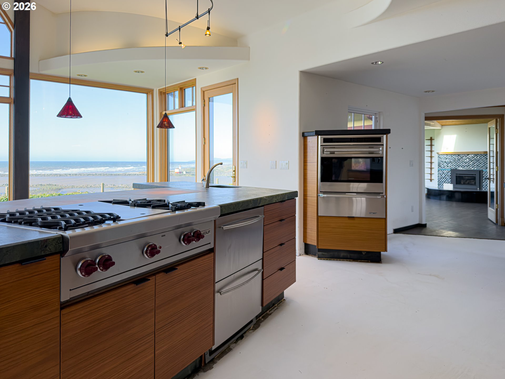 880 Ocean Drive Southwest Bandon, OR 97411 - Photo 17 of 48 a kitchen with stainless steel appliances granite countertop a stove and a sink
