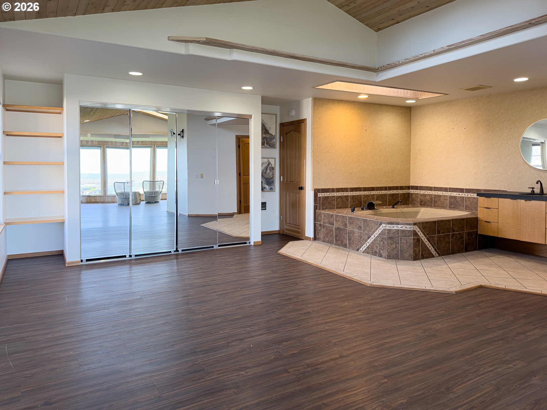 880 Ocean Drive Southwest Bandon, OR 97411 - Photo 26 of 48 a view of a room with wooden floor and door