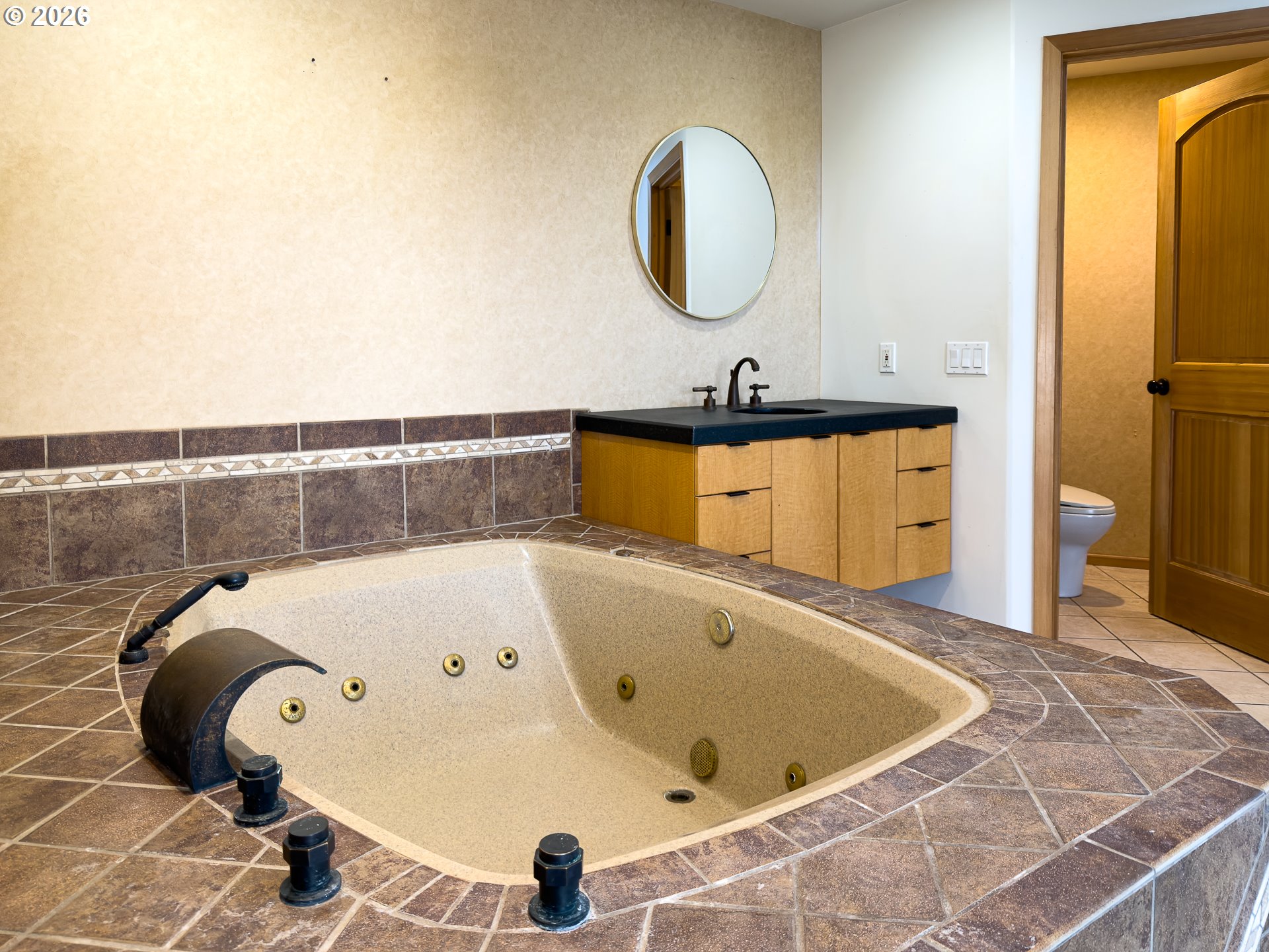 880 Ocean Drive Southwest Bandon, OR 97411 - Photo 28 of 48 a bathroom with a tub and mirror