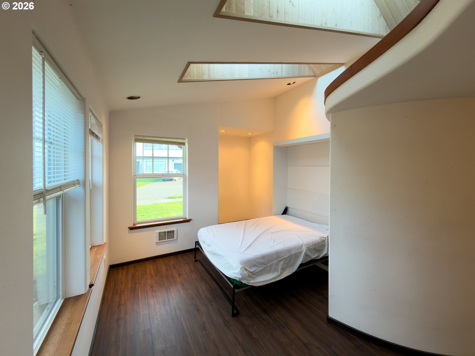 880 Ocean Drive Southwest Bandon, OR 97411 - Photo 37 of 48 a bedroom with a bed and a window