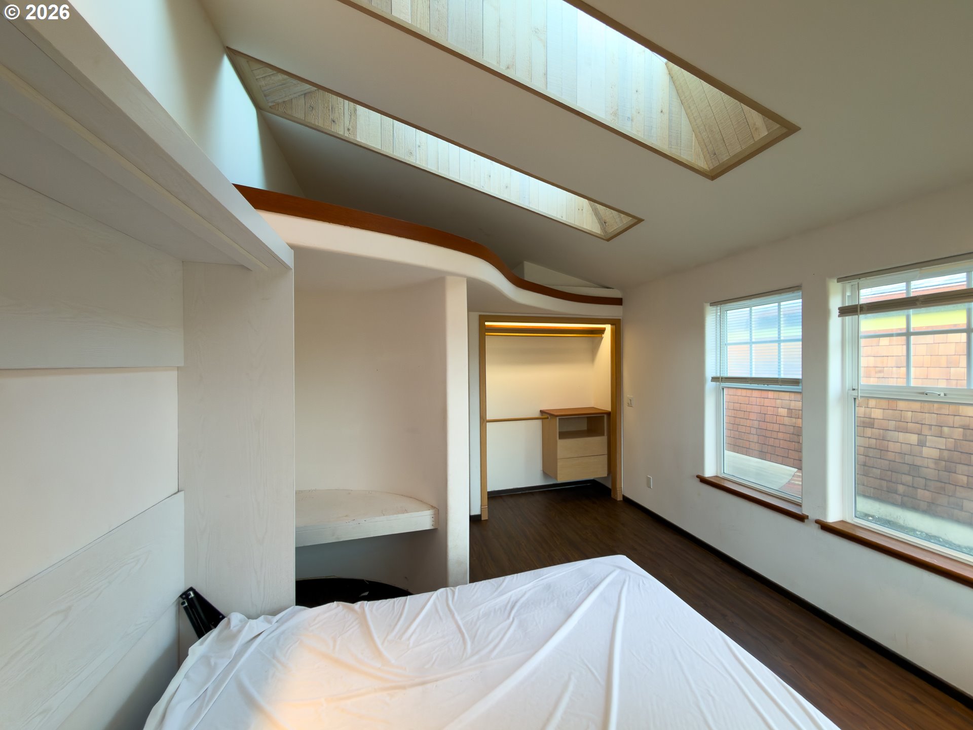 880 Ocean Drive Southwest Bandon, OR 97411 - Photo 38 of 48 a bedroom with a bed and a large window with outer view