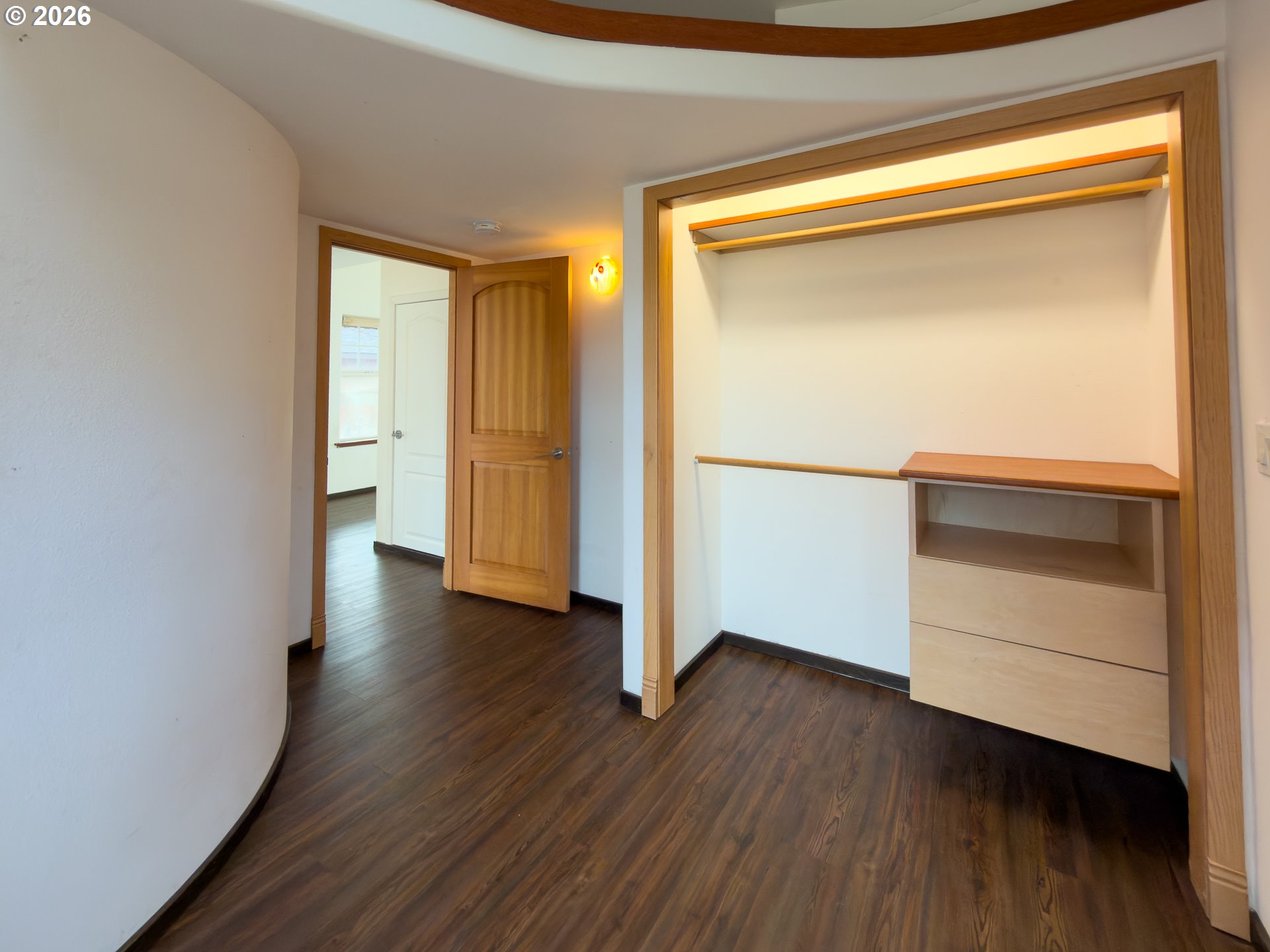 880 Ocean Drive Southwest Bandon, OR 97411 - Photo 39 of 48 a view of an empty room with wooden floor and a window