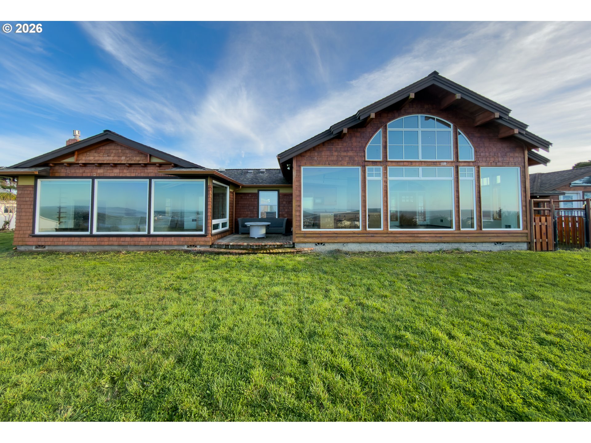 880 Ocean Drive Southwest Bandon, OR 97411 - Photo 40 of 48 a front view of a house with a yard