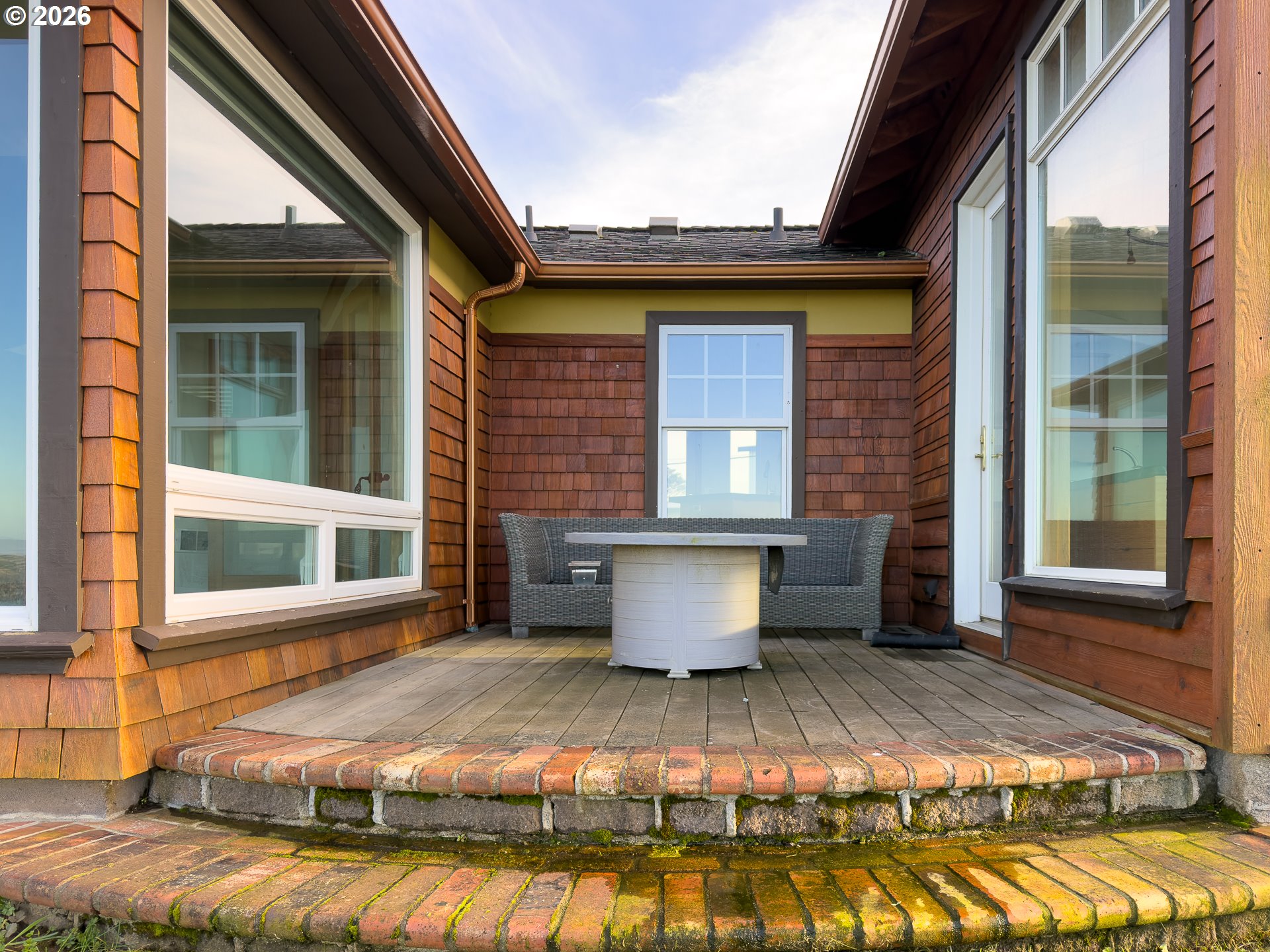 880 Ocean Drive Southwest Bandon, OR 97411 - Photo 41 of 48 a view of house with yard outdoor seating area