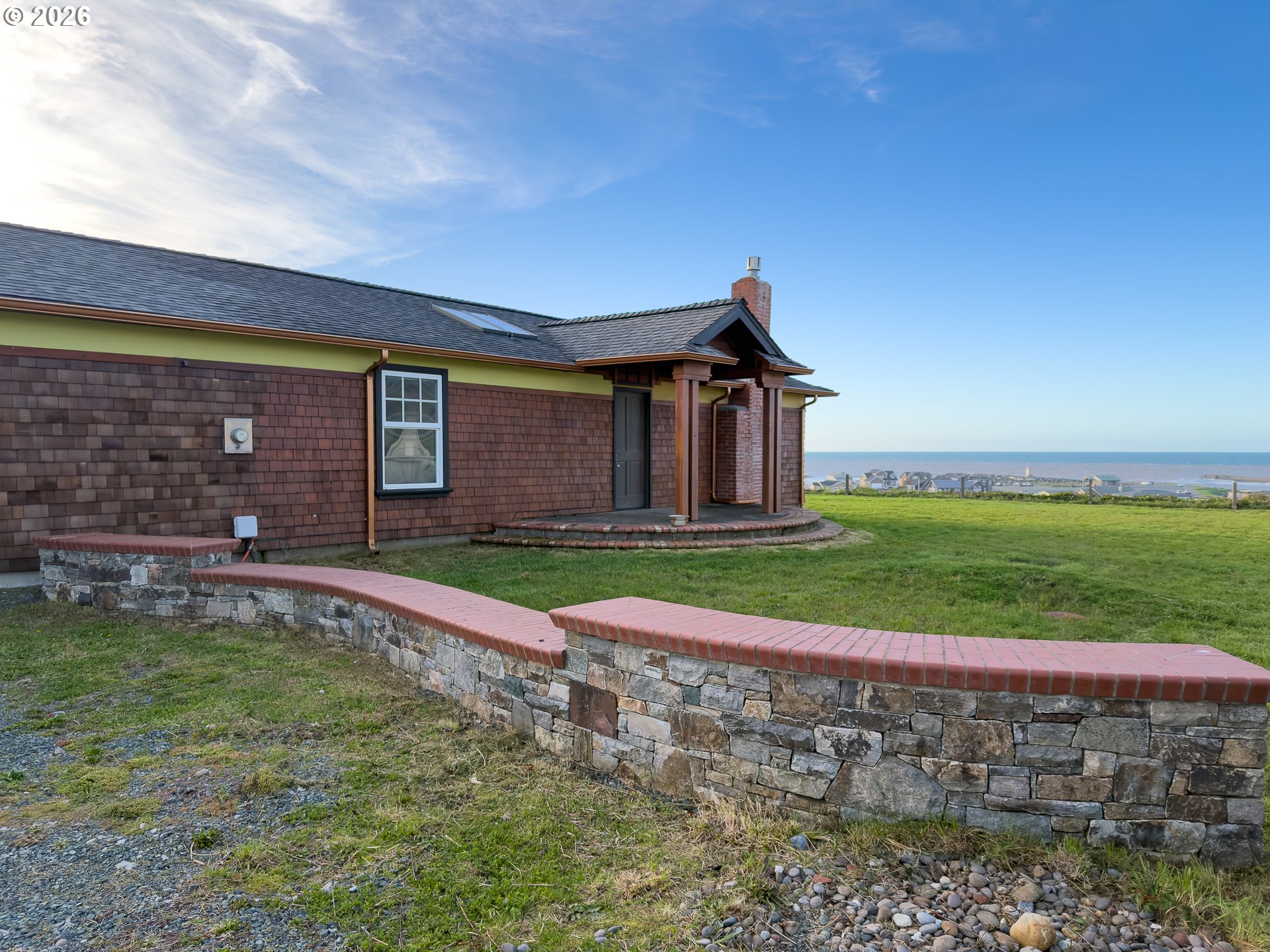 880 Ocean Drive Southwest Bandon, OR 97411 - Photo 42 of 48 a view of a house with a yard