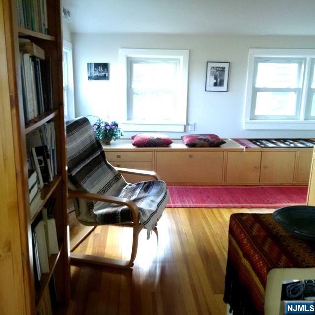 3 Old Wood Road, Unit 2 Edgewater, NJ 07020 - Photo 2 of 10 a room with furniture and a window