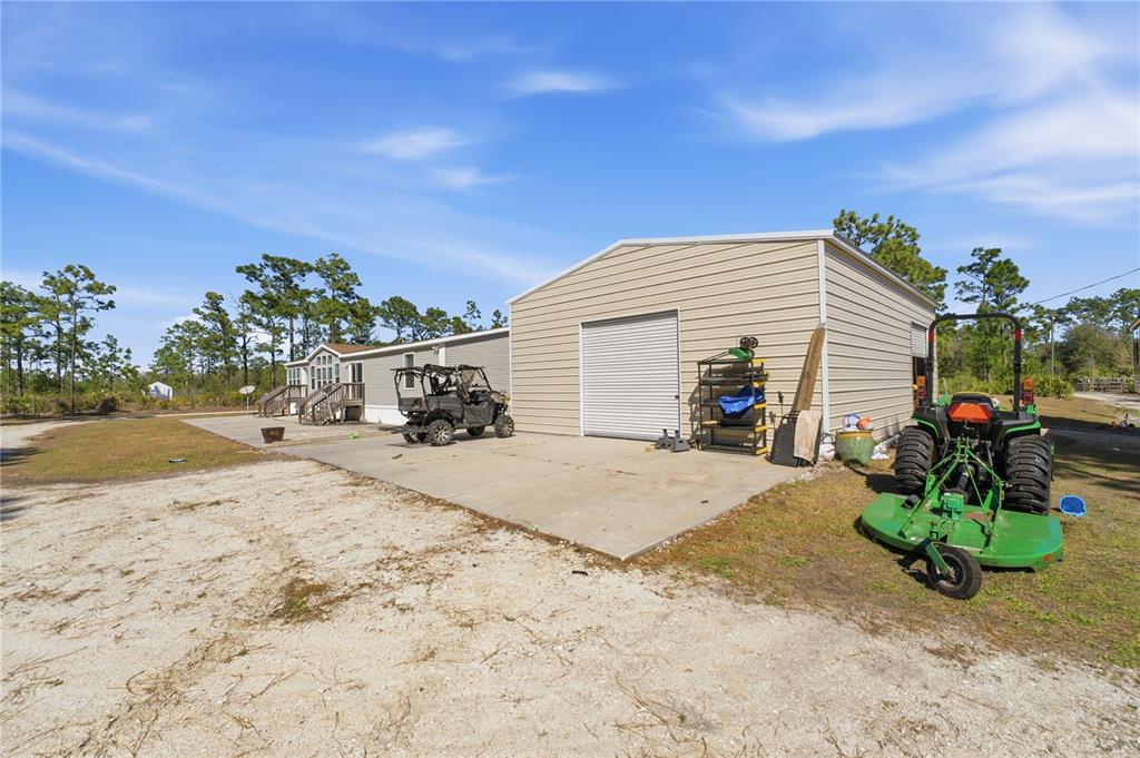 6844 Chad Jason Road St. Cloud, FL 34773 - Photo 47 of 59 a view of a house with a patio