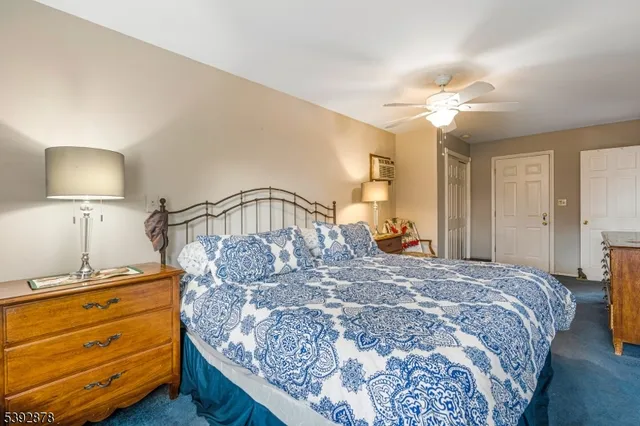 a bedroom with a bed and a mirror