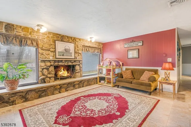 a living room with furniture and a rug