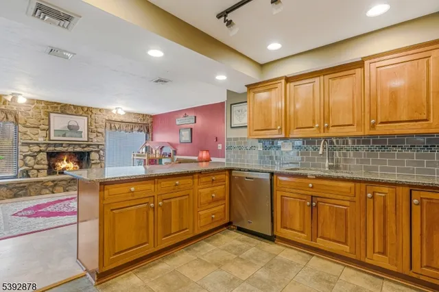 a kitchen with sink cabinets and window
