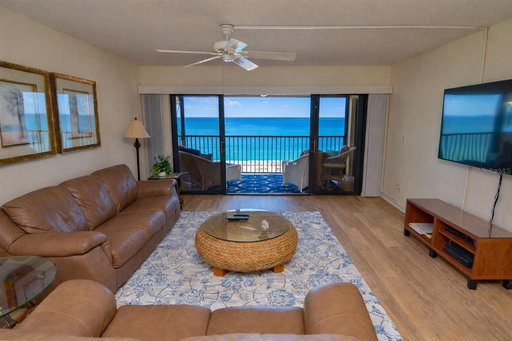 900 Gulf Boulevard, Unit 907 Indian Rocks Beach, FL 33785 - Photo 18 of 88 a living room with furniture and a flat screen tv