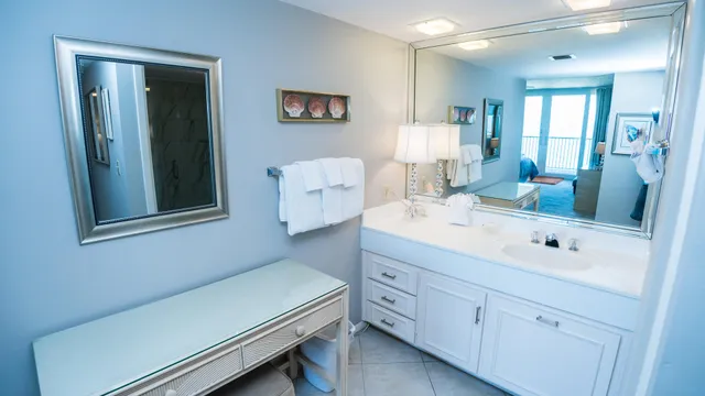 a en suite bathroom with a sink and a mirror