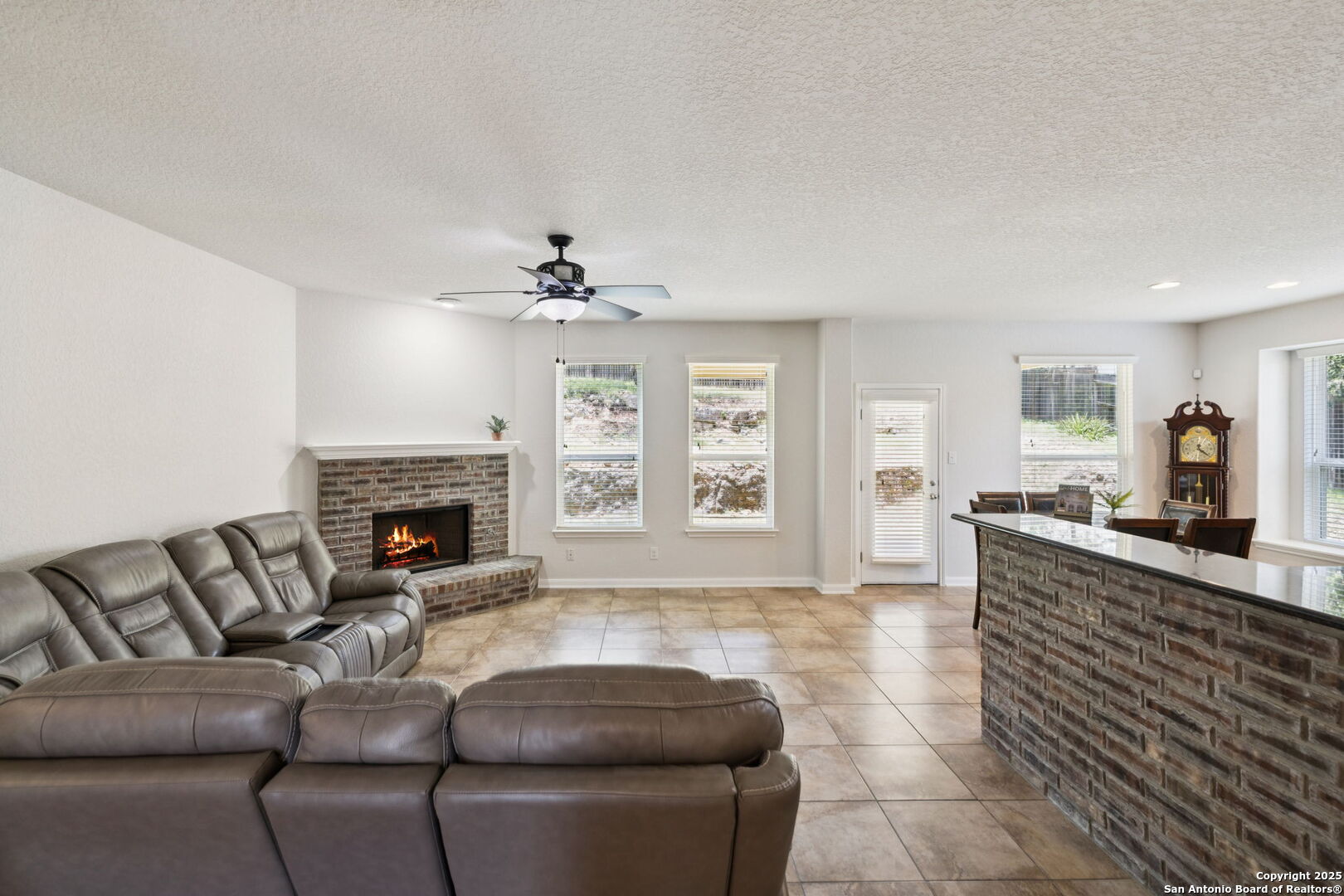 23567 7 Winds San Antonio, TX 78258 - Photo 16 of 49 a living room with furniture and a fireplace