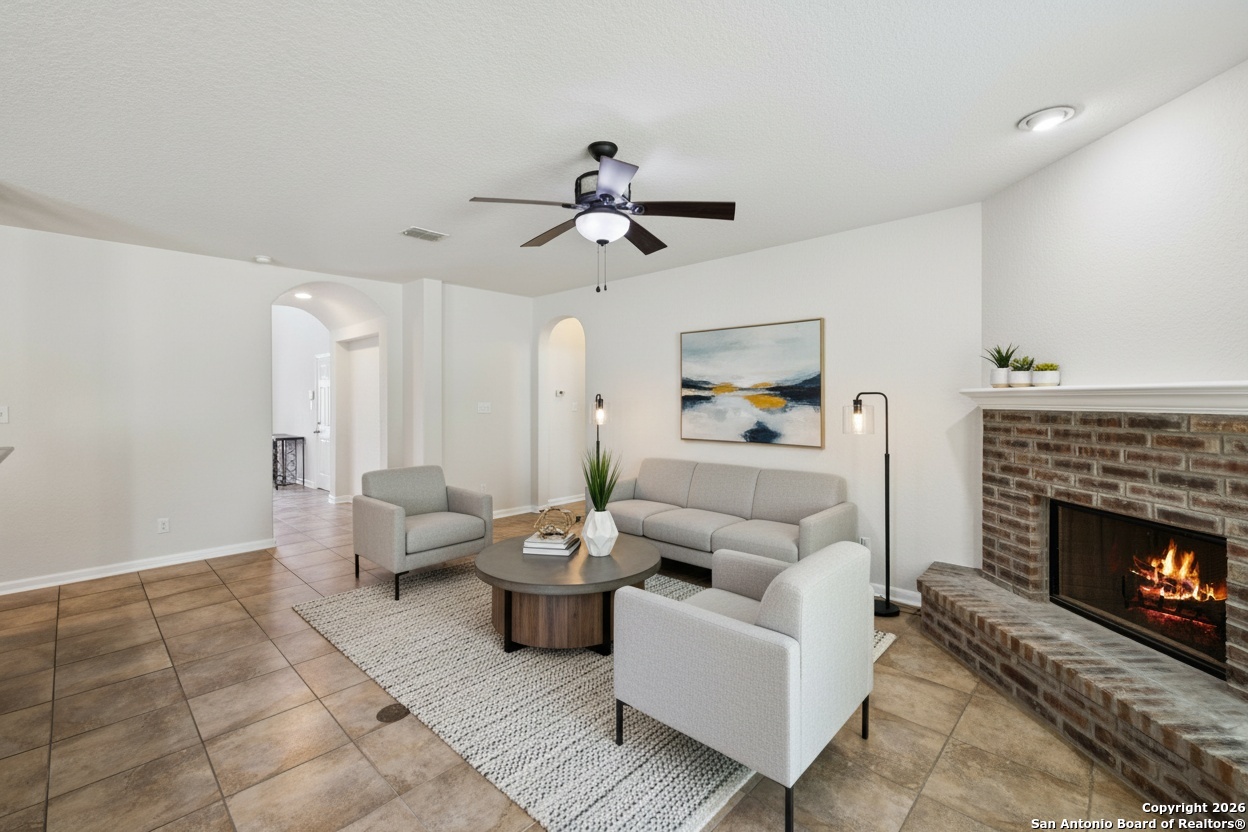 23567 7 Winds San Antonio, TX 78258 - Photo 17 of 49 a living room with furniture and a fireplace