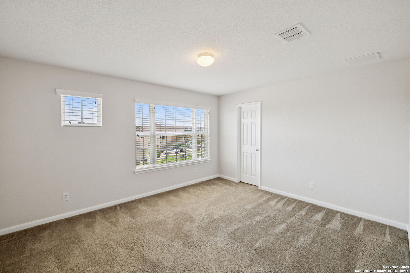 23567 7 Winds San Antonio, TX 78258 - Photo 26 of 49 a view of an empty room with a window