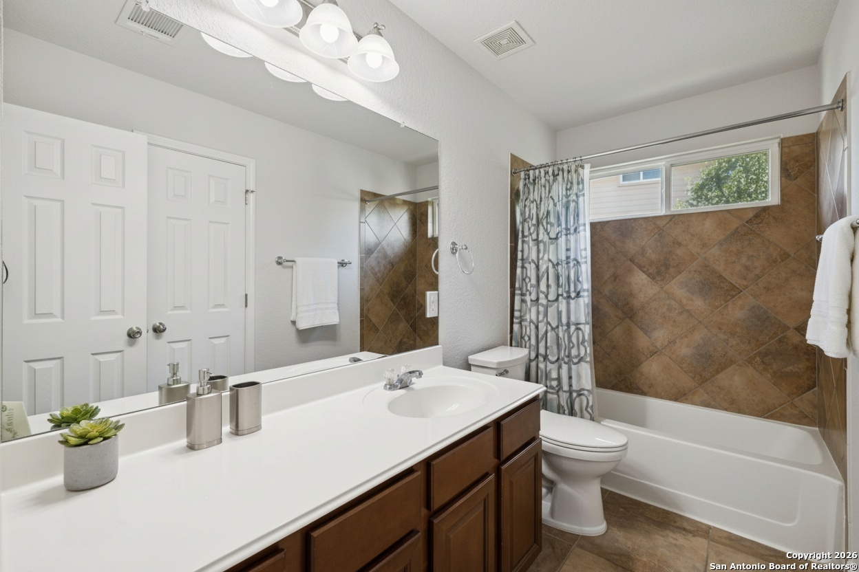 23567 7 Winds San Antonio, TX 78258 - Photo 31 of 49 a bathroom with a sink a toilet and shower