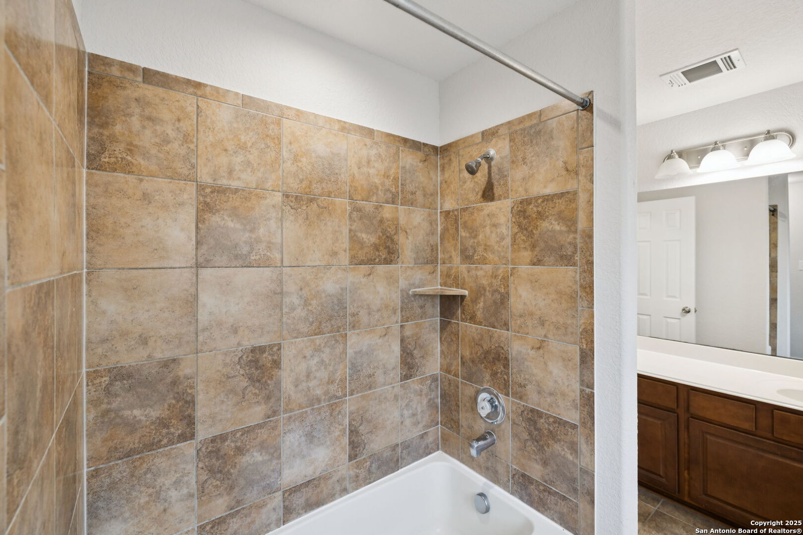 23567 7 Winds San Antonio, TX 78258 - Photo 34 of 49 a bathroom with a shower and sink