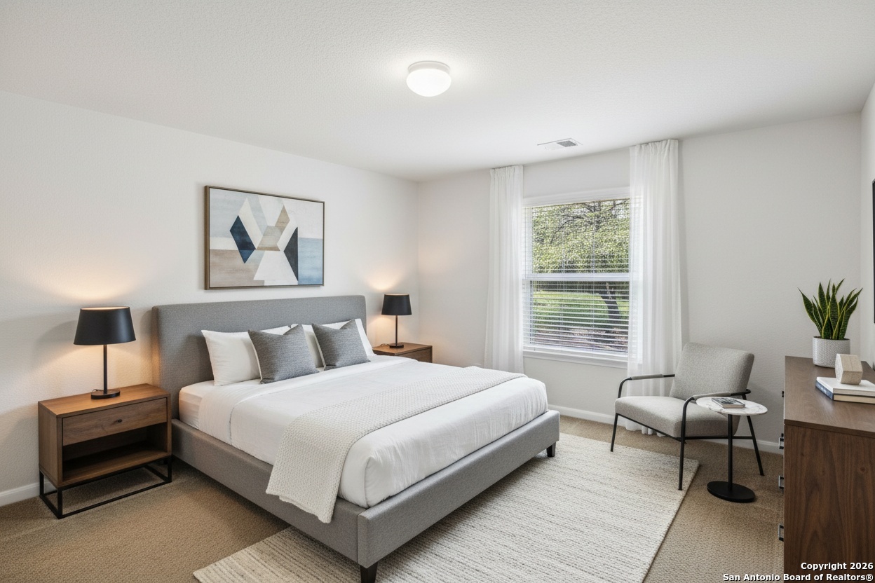 23567 7 Winds San Antonio, TX 78258 - Photo 37 of 49 a bedroom with a bed and a couch