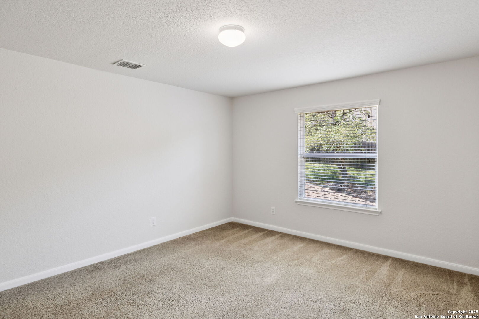 23567 7 Winds San Antonio, TX 78258 - Photo 38 of 49 an empty room with a window