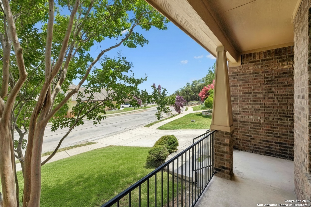 23567 7 Winds San Antonio, TX 78258 - Photo 4 of 49 a view of a pathway of a yard with wooden fence