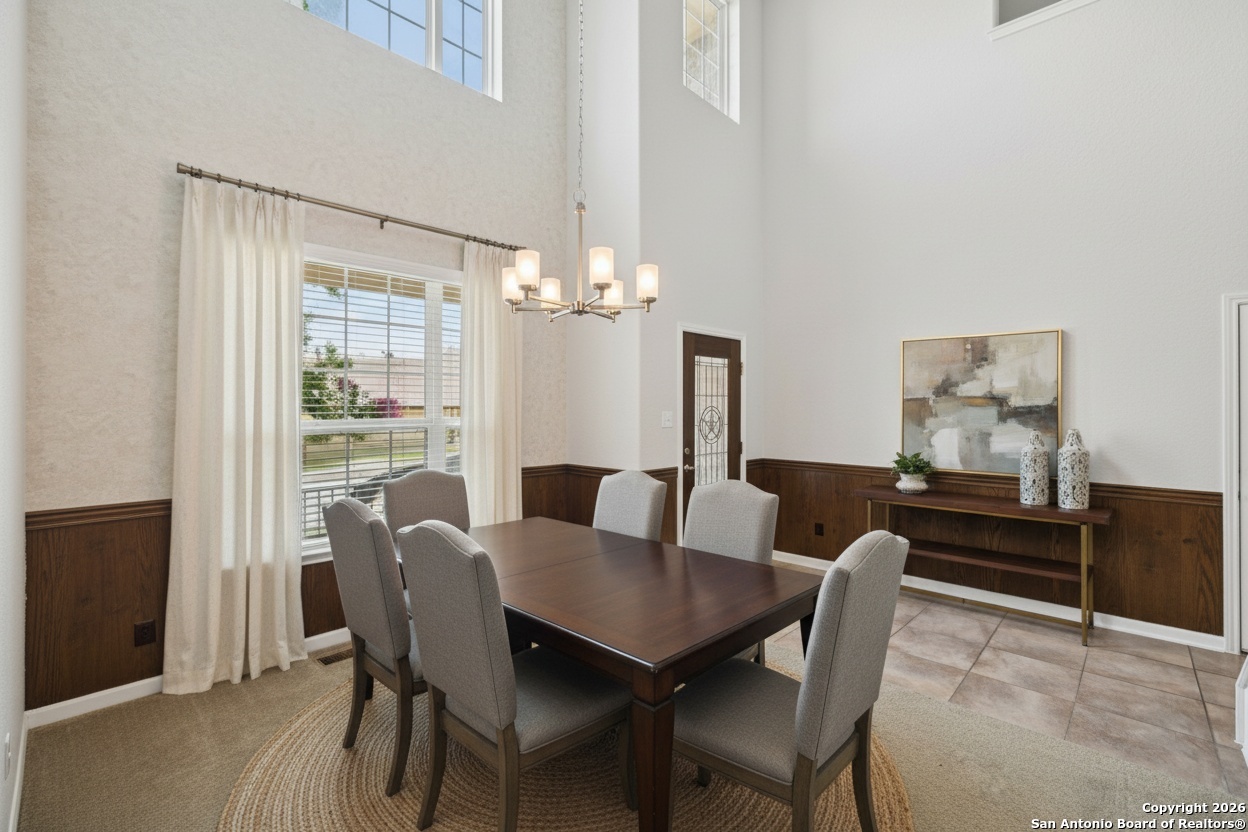 23567 7 Winds San Antonio, TX 78258 - Photo 6 of 49 a view of a dining room with furniture window and wooden floor
