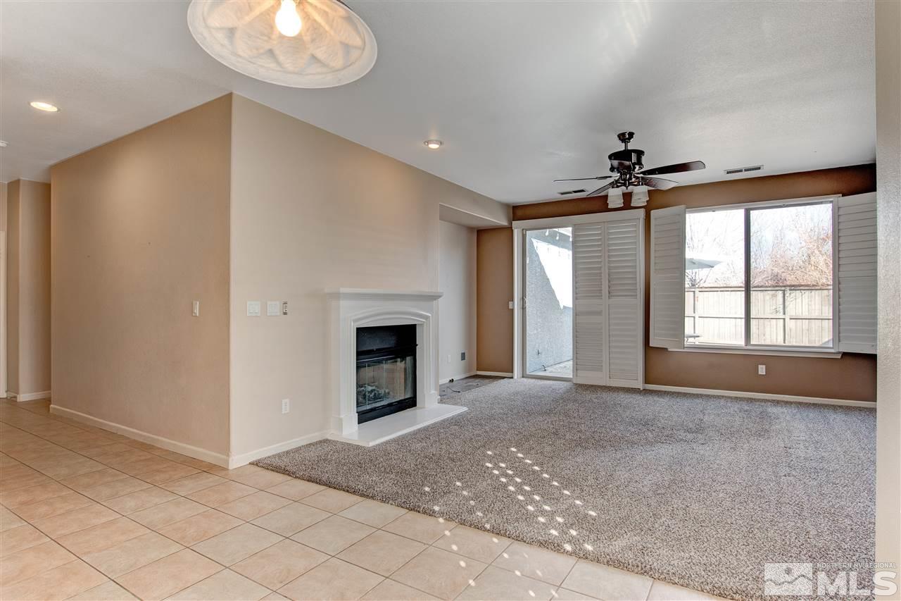 475 Dartmoor Court Reno, NV 89521 - Photo 12 of 35 an empty room with windows and fireplace