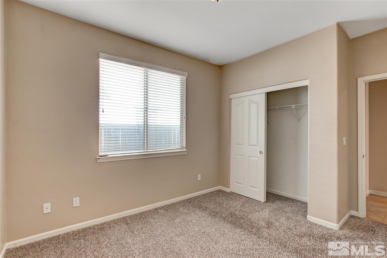 475 Dartmoor Court Reno, NV 89521 - Photo 26 of 35 a view of an empty room with closet and a window
