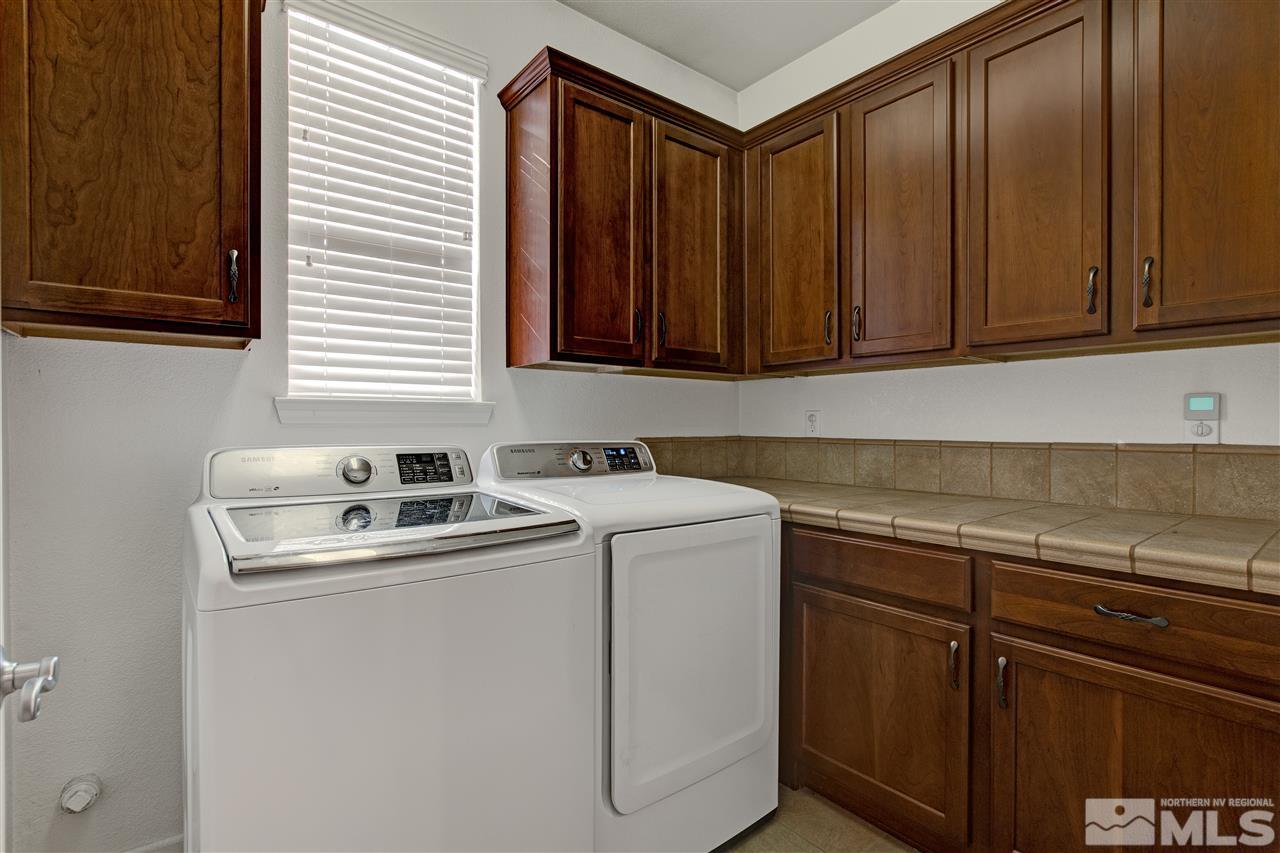 475 Dartmoor Court Reno, NV 89521 - Photo 29 of 35 a kitchen with sink and cabinets