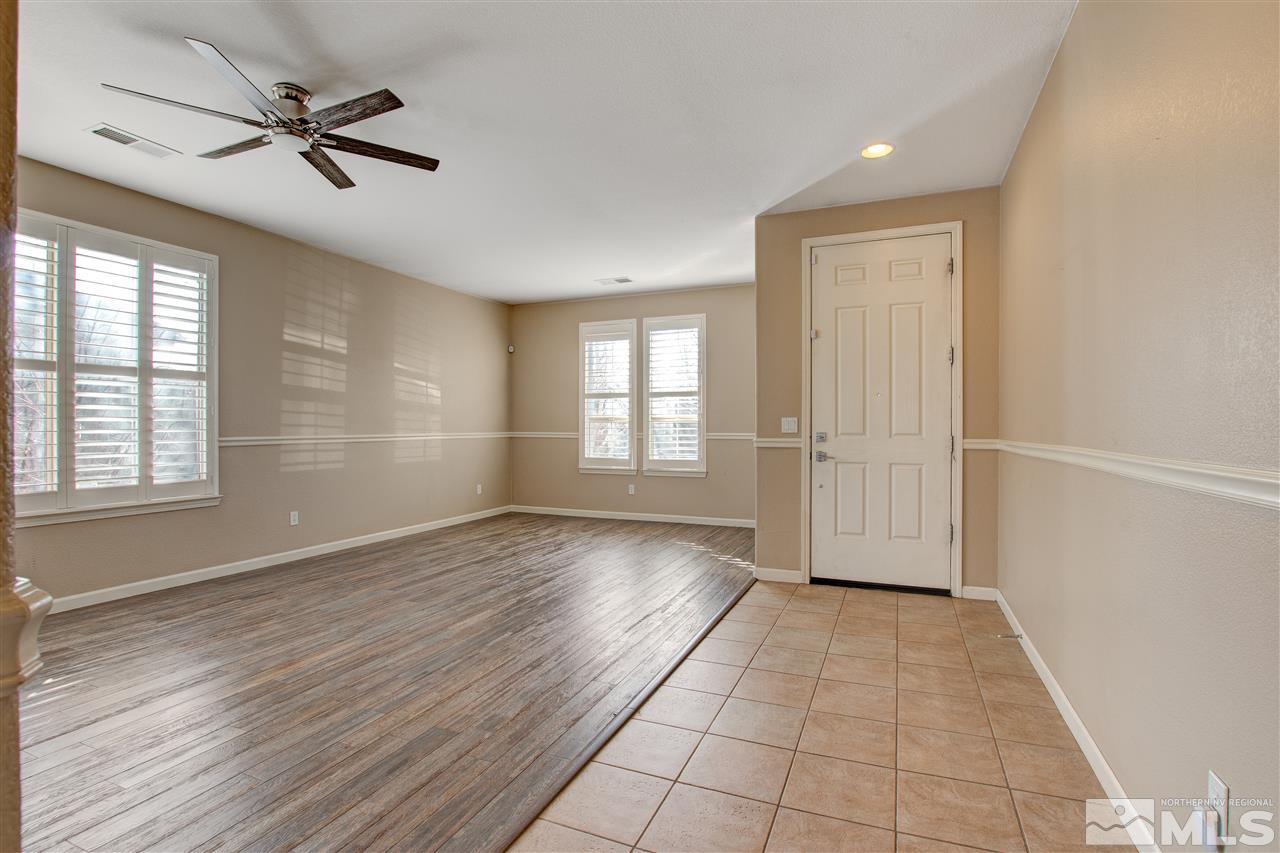 475 Dartmoor Court Reno, NV 89521 - Photo 3 of 35 wooden floor in an empty room with a window