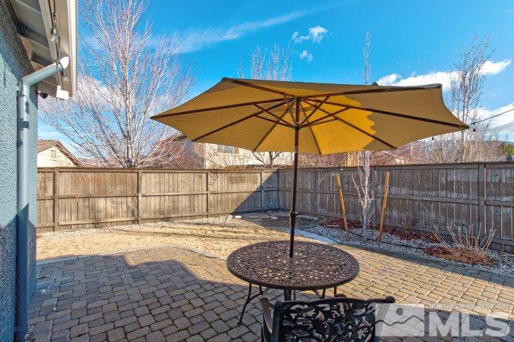 475 Dartmoor Court Reno, NV 89521 - Photo 33 of 35 a backyard of a house with garden and patio