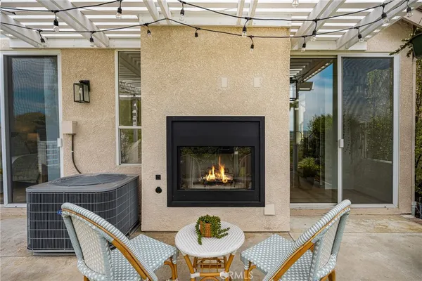 a view of a chairs and table in the patio