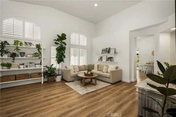 a living room with furniture fireplace and window