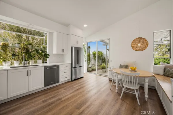 a kitchen with stainless steel appliances a refrigerator and a sink