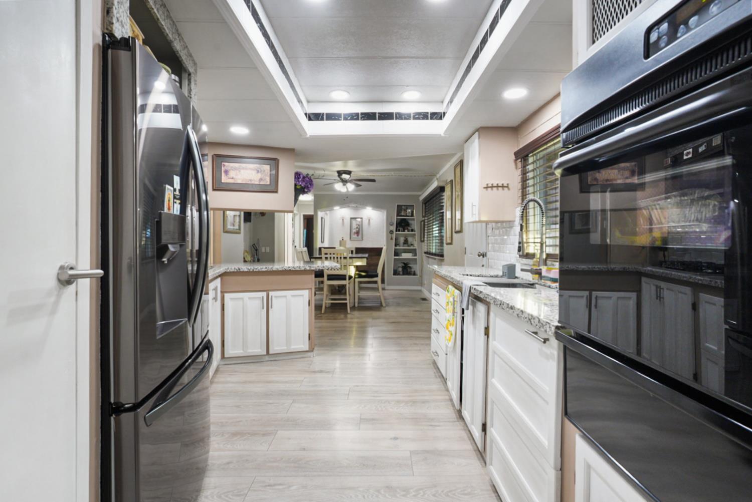 4837 Faith Home Road, Unit 162 Ceres, CA 95307 - Photo 12 of 45 a kitchen with counter top space and stainless steel appliances