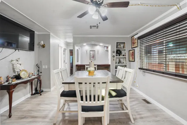 a view of a dining room with furniture window and wooden floor