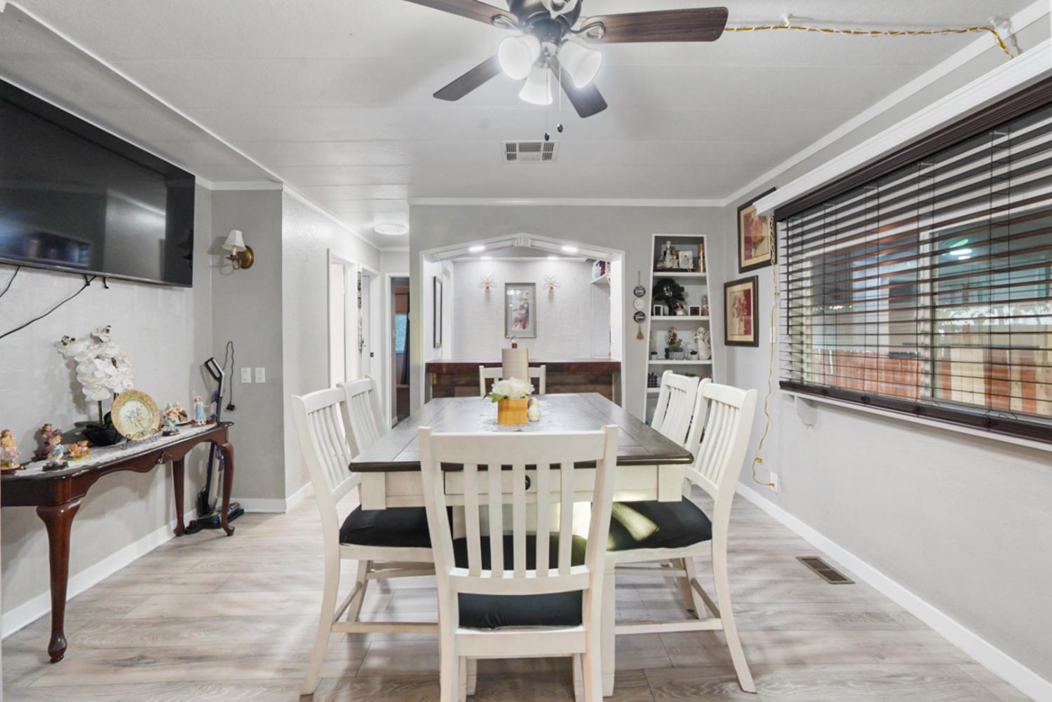 4837 Faith Home Road, Unit 162 Ceres, CA 95307 - Photo 16 of 45 a view of a dining room with furniture window and wooden floor