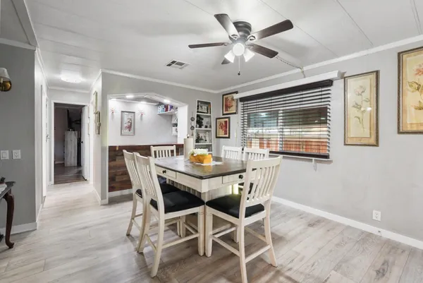 a view of a hallway with wooden shelves