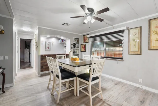 a view of a hallway with wooden shelves