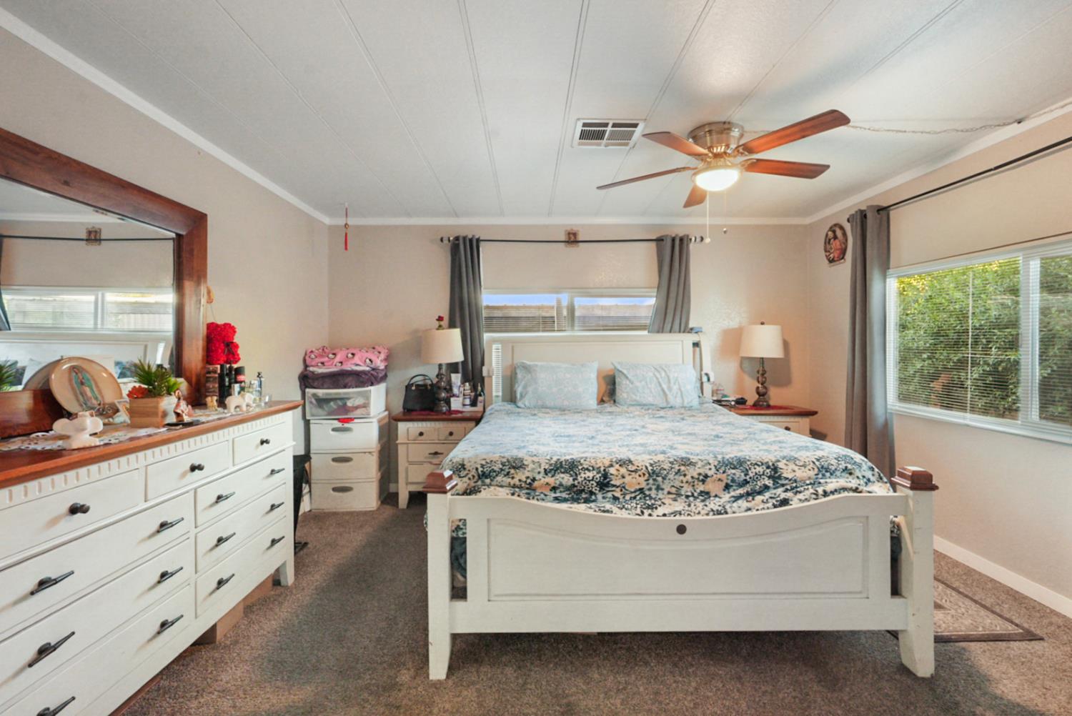 4837 Faith Home Road, Unit 162 Ceres, CA 95307 - Photo 25 of 45 a bedroom with a bed and a dresser