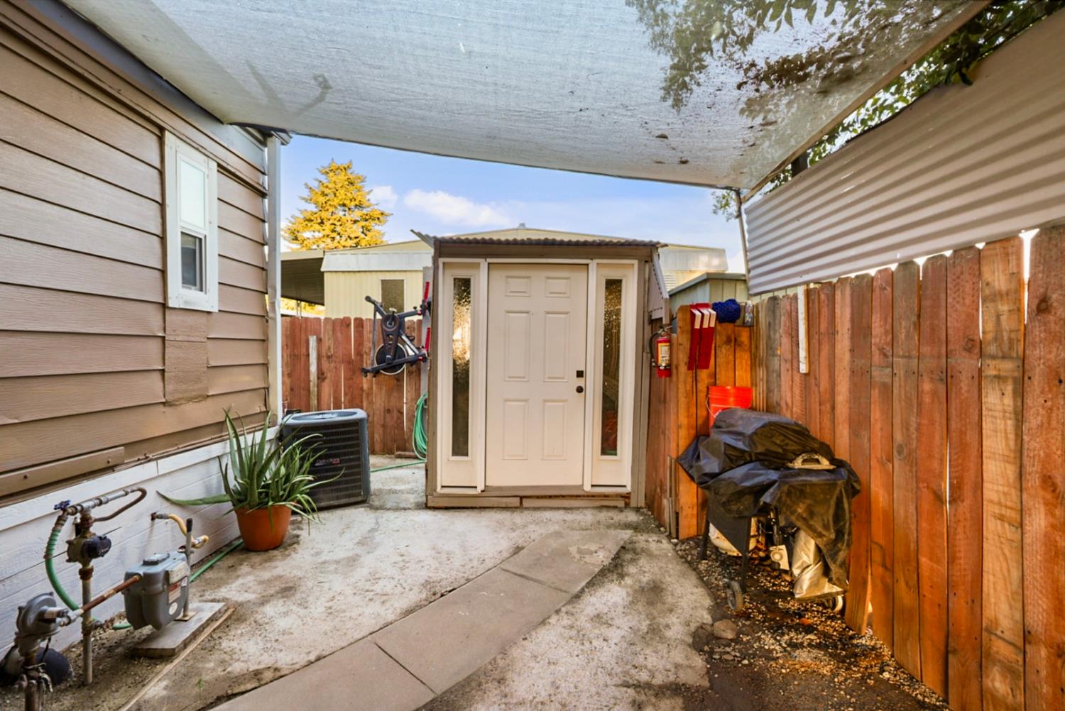 4837 Faith Home Road, Unit 162 Ceres, CA 95307 - Photo 29 of 45 a view of a garage with stuff